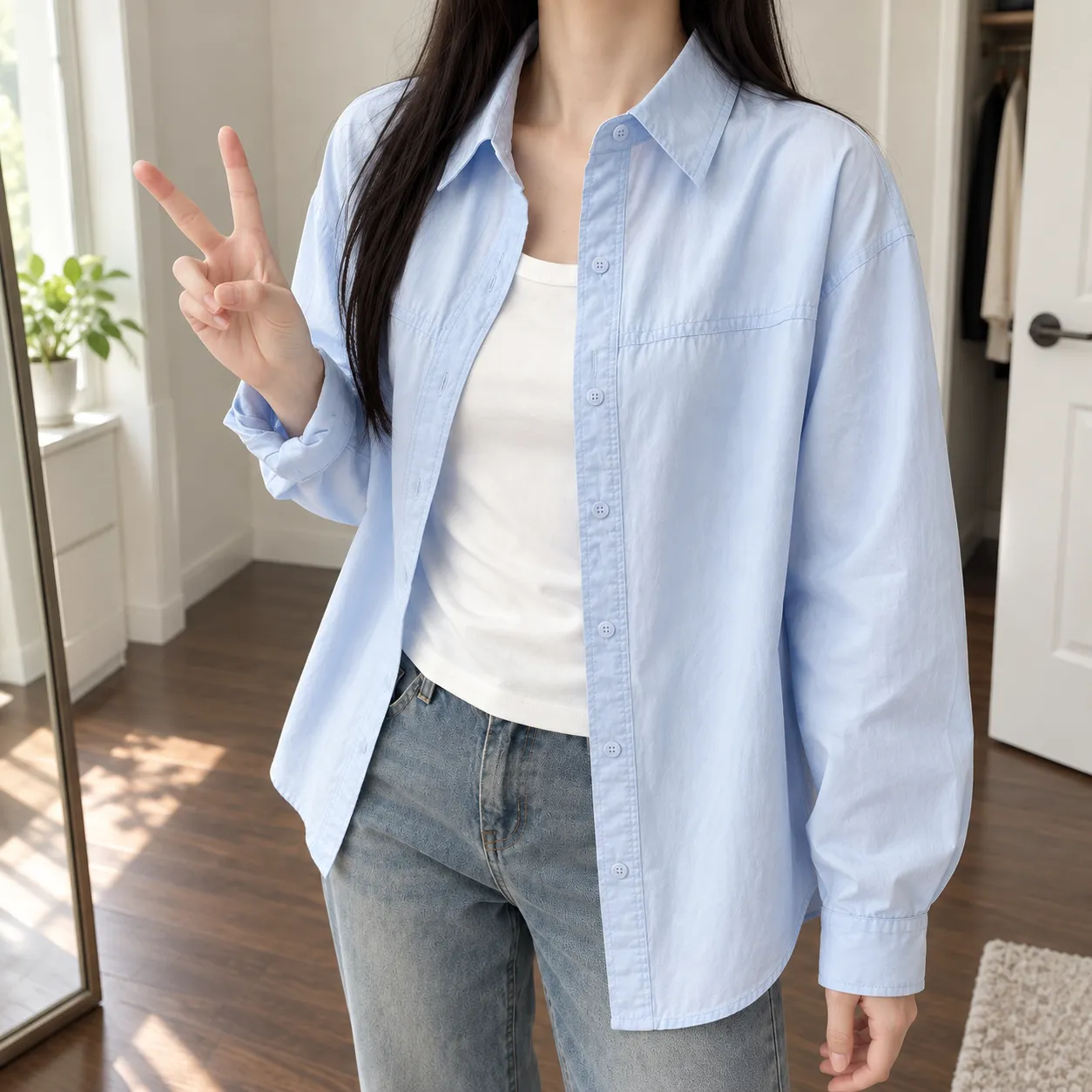 Clara shirt worn with bent elbow to show relaxed fit